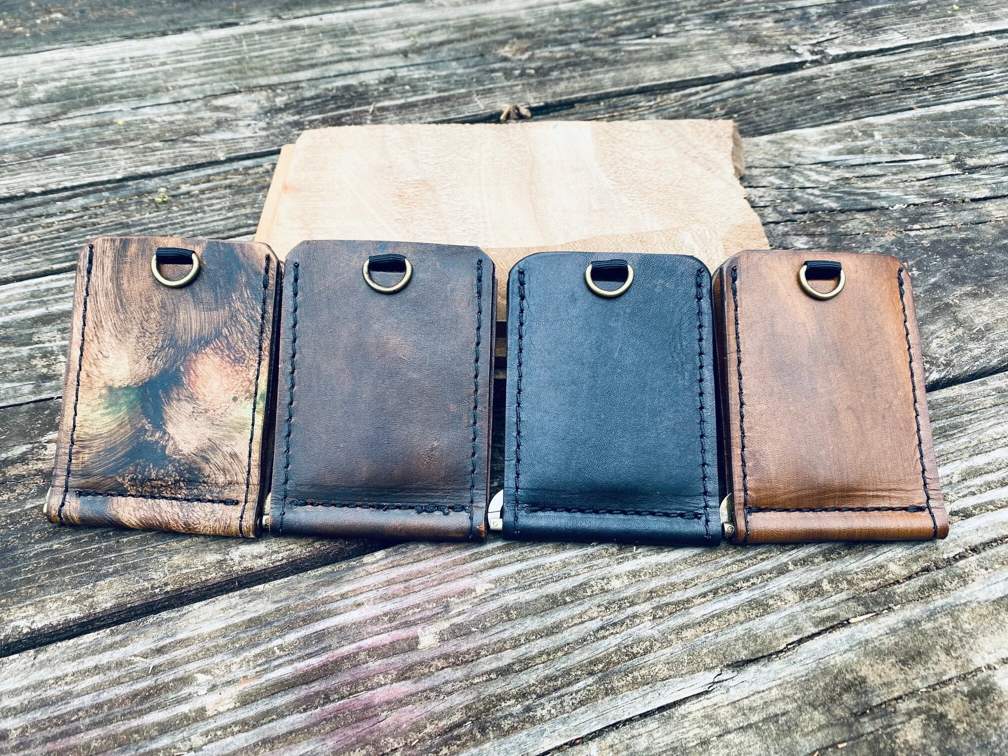 Minimalist pull-up wallets in multiple leather finishes.
